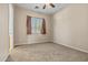 Bedroom with carpet, curtains and neutral walls at 14333 W Alvarado Dr, Goodyear, AZ 85395