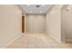 Empty room with tile flooring, neutral walls, and ample natural light. Ready for personalization! at 14333 W Alvarado Dr, Goodyear, AZ 85395