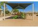 Community playground with colorful play structure and sunshade, designed for safe and fun activities at 14333 W Alvarado Dr, Goodyear, AZ 85395