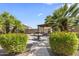 Lush backyard featuring a decorative fountain and a shaded patio area perfect for relaxation at 1449 W Sherri Dr, Gilbert, AZ 85233