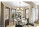 Bright breakfast nook with a round table and large window offering a pleasant view at 1449 W Sherri Dr, Gilbert, AZ 85233