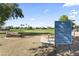 Community park featuring an open field and signage displaying park rules and regulations at 1449 W Sherri Dr, Gilbert, AZ 85233