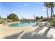 Enjoy the community pool with lounge chairs, umbrellas, ramada and well-maintained landscaping at 1449 W Sherri Dr, Gilbert, AZ 85233