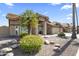 Charming home with a well-maintained front yard and a decorative desert landscape at 1449 W Sherri Dr, Gilbert, AZ 85233