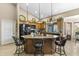 Spacious kitchen with an island, barstool seating, and decorative accents at 1449 W Sherri Dr, Gilbert, AZ 85233