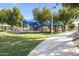 Community park featuring shaded picnic areas, playground and paved walkway at 1449 W Sherri Dr, Gilbert, AZ 85233