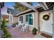 Inviting front porch featuring rocking chairs and a small table, perfect for relaxing outdoors at 16437 N 61St Ave, Glendale, AZ 85306