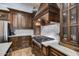 Elegant kitchen with custom cabinetry, quartz countertops, stainless steel gas cooktop and white subway tile backsplash at 16437 N 61St Ave, Glendale, AZ 85306