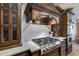 Stylish kitchen featuring a stainless steel gas cooktop, custom cabinetry, and white subway tile backsplash at 16437 N 61St Ave, Glendale, AZ 85306