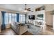 Cozy living room with natural light, wood floors, ceiling fan, and comfortable seating at 16437 N 61St Ave, Glendale, AZ 85306