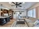 Open living area with modern furnishings and access to a flex room at 16437 N 61St Ave, Glendale, AZ 85306