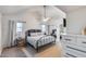 Sunlit main bedroom with vaulted ceilings and stylish decor at 16437 N 61St Ave, Glendale, AZ 85306