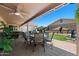 Backyard area features covered dining and grill with easy access for entertaining guests at 1753 Leisure World --, Mesa, AZ 85206