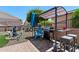 Outdoor kitchen and barbeque in backyard with beautiful plants, outdoor furniture, and water features at 1753 Leisure World --, Mesa, AZ 85206