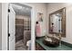 Charming bathroom with decorative sink, glass block shower, and stylish fixtures at 1753 Leisure World --, Mesa, AZ 85206