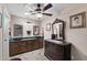 Elegant bathroom with dual vessel sinks, decorative mirrors, and a sophisticated vanity at 1753 Leisure World --, Mesa, AZ 85206