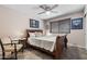 Serene bedroom with natural light, chair, and a decorative quilt on the bed at 1753 Leisure World --, Mesa, AZ 85206