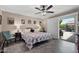 Comfortable bedroom with ceiling fan, natural light, and sliding door access to the backyard at 1753 Leisure World --, Mesa, AZ 85206