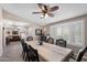Open-concept dining room with views of the living room and shuttered windows for natural light at 1753 Leisure World --, Mesa, AZ 85206