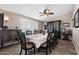 Formal dining room with wainscoting, chandelier, large windows with shutters, and ample seating at 1753 Leisure World --, Mesa, AZ 85206