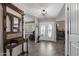Inviting foyer with tile flooring, coat rack, stained glass double doors, and neutral decor at 1753 Leisure World --, Mesa, AZ 85206