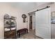 Hallway showcasing modern decor, with storage and a barn door accent at 1753 Leisure World --, Mesa, AZ 85206