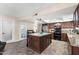 Spacious kitchen with large island, modern appliances, and access to a pantry at 1753 Leisure World --, Mesa, AZ 85206