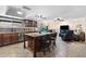 Open concept kitchen with a large island and seamless flow into the living area at 1753 Leisure World --, Mesa, AZ 85206