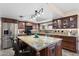 Well-equipped kitchen featuring an island, pendant lights, and stainless steel appliances at 1753 Leisure World --, Mesa, AZ 85206
