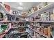 Organized pantry featuring stocked shelves with varied food items at 1753 Leisure World --, Mesa, AZ 85206