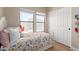 Cozy bedroom with bright windows, wood floors, and a large closet at 17560 W Young St, Surprise, AZ 85388