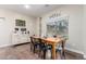 Dining room with a wooden table, black chairs, and decorative wall art at 17560 W Young St, Surprise, AZ 85388