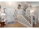 Bright foyer with white door and staircase, providing a welcoming entrance at 17560 W Young St, Surprise, AZ 85388