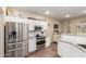 Open kitchen with stainless steel appliances and granite countertops at 17560 W Young St, Surprise, AZ 85388