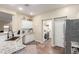 Kitchen with granite counters and stainless steel appliances, adjacent to the laundry room at 17560 W Young St, Surprise, AZ 85388