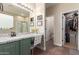 Elegant bathroom with a granite countertop vanity and a glass-enclosed shower at 17560 W Young St, Surprise, AZ 85388