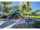 Community playground with multiple slides, climbing structures, and benches in a park-like setting at 17560 W Young St, Surprise, AZ 85388