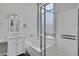 Bright bathroom features a tub, glass-enclosed shower, and marble vanity at 1821 S Navajo Way, Chandler, AZ 85286