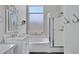 Bright bathroom features a tub, glass-enclosed shower, and marble vanity at 1821 S Navajo Way, Chandler, AZ 85286