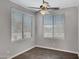 Bright bedroom featuring wood floors, neutral paint, a ceiling fan, and lots of natural light at 1821 S Navajo Way, Chandler, AZ 85286