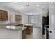 Well-appointed kitchen with granite countertops, an island, wood cabinets, and stainless steel appliances at 1821 S Navajo Way, Chandler, AZ 85286