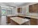 Well-lit kitchen featuring granite countertops, stainless steel appliances, and dark wood cabinetry at 1821 S Navajo Way, Chandler, AZ 85286