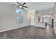 Bright and open living space with vaulted ceilings, tile flooring, and an arched window at 1821 S Navajo Way, Chandler, AZ 85286