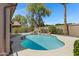 Sparkling pool set within a private backyard, surrounded by lush greenery at 1821 S Navajo Way, Chandler, AZ 85286