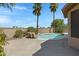 Desert backyard pool and patio is surrounded by mature landscaping at 1821 S Navajo Way, Chandler, AZ 85286