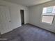 Comfortable carpeted bedroom with a closet and window, providing ample natural light at 18361 E Eloisa Dr, Gold Canyon, AZ 85118