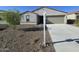 Charming single-story home with a gravel front yard and a two-car garage, offering modern suburban living at 18361 E Eloisa Dr, Gold Canyon, AZ 85118