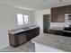 Well-lit kitchen with stainless steel appliances, granite countertops, and a walk-in pantry at 18361 E Eloisa Dr, Gold Canyon, AZ 85118