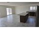 Bright living room adjacent to the kitchen with sliding glass doors and backyard access at 18361 E Eloisa Dr, Gold Canyon, AZ 85118