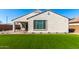 Well-kept backyard featuring synthetic lawn, creating a perfect outdoor space for activities and enjoyment at 19595 W San Miguel Ave, Litchfield Park, AZ 85340